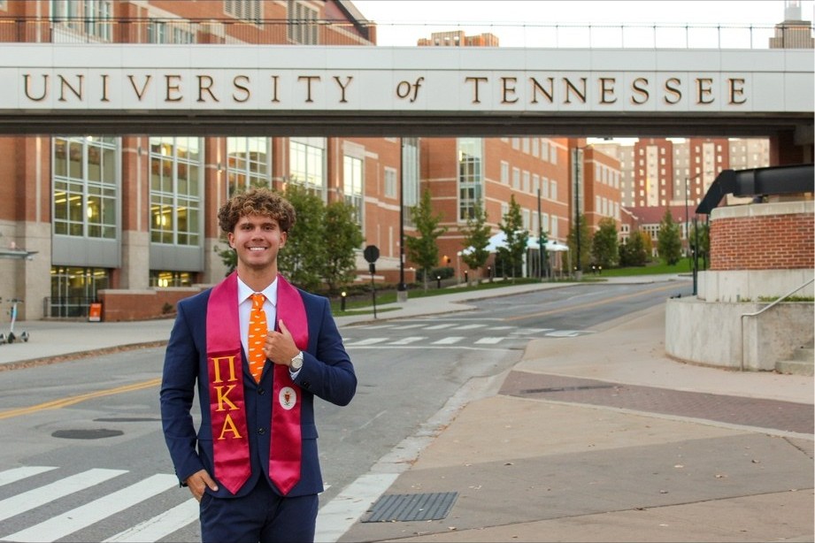 Brett Hart, owner of Volunteer Turf & Weed Control, standing at the University of Tennessee Knoxville